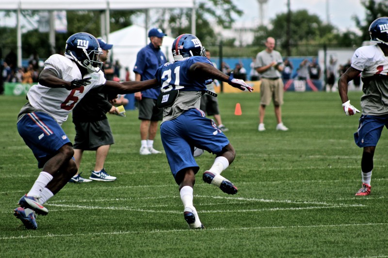 Dominique Rodgers- Cromartie breaks past Corey Washington on a bltiz in practice.  Credit: BOBBY O'HARA/PureSportsNY