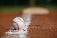 17729191-baseball-on-the-infield-chalk-line-with-the-base-in-the-distance