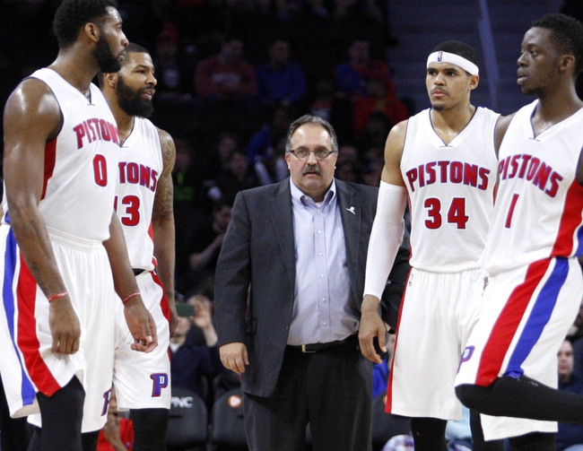 Mar 21, 2016; Auburn Hills, MI, USA; (Left to right) Detroit Pistons center Andre Drummond (0) forward Marcus Morris (13) head coach Stan Van Gundy forward Tobias Harris (34) and guard Reggie Jackson (1) stand during a timeout during the fourth quarter against the Milwaukee Bucks at The Palace of Auburn Hills. Pistons win 92-91. Mandatory Credit: Raj Mehta-USA TODAY Sports