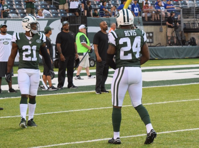 (Photo Credit: Barry Holmes) Revis and Marcus Gilchrist in warm-ups Saturday night.