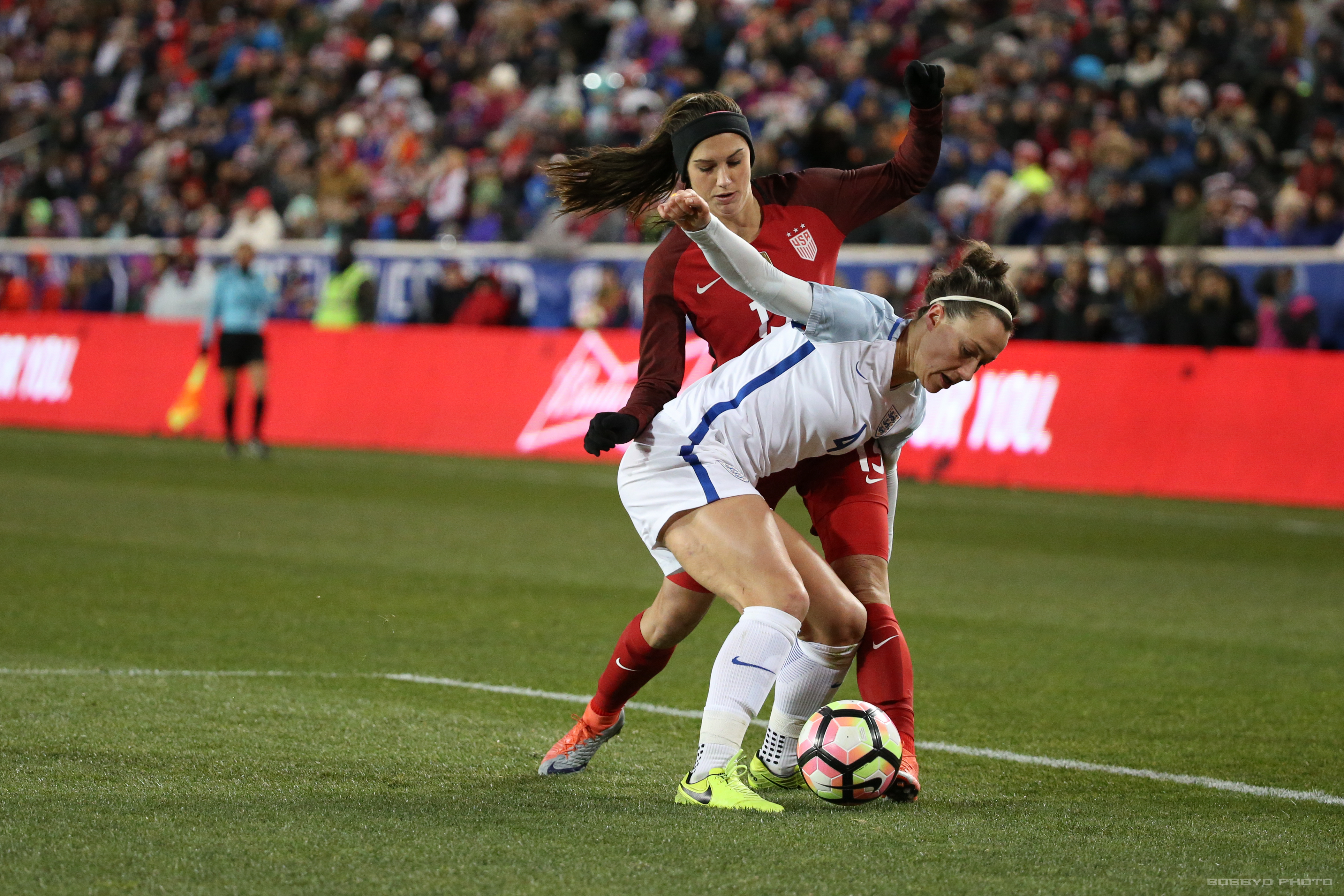 Alex Morgan dribbles through a defender in the first half. Photo (Bobby O'Hara/ PuresportsNY)
