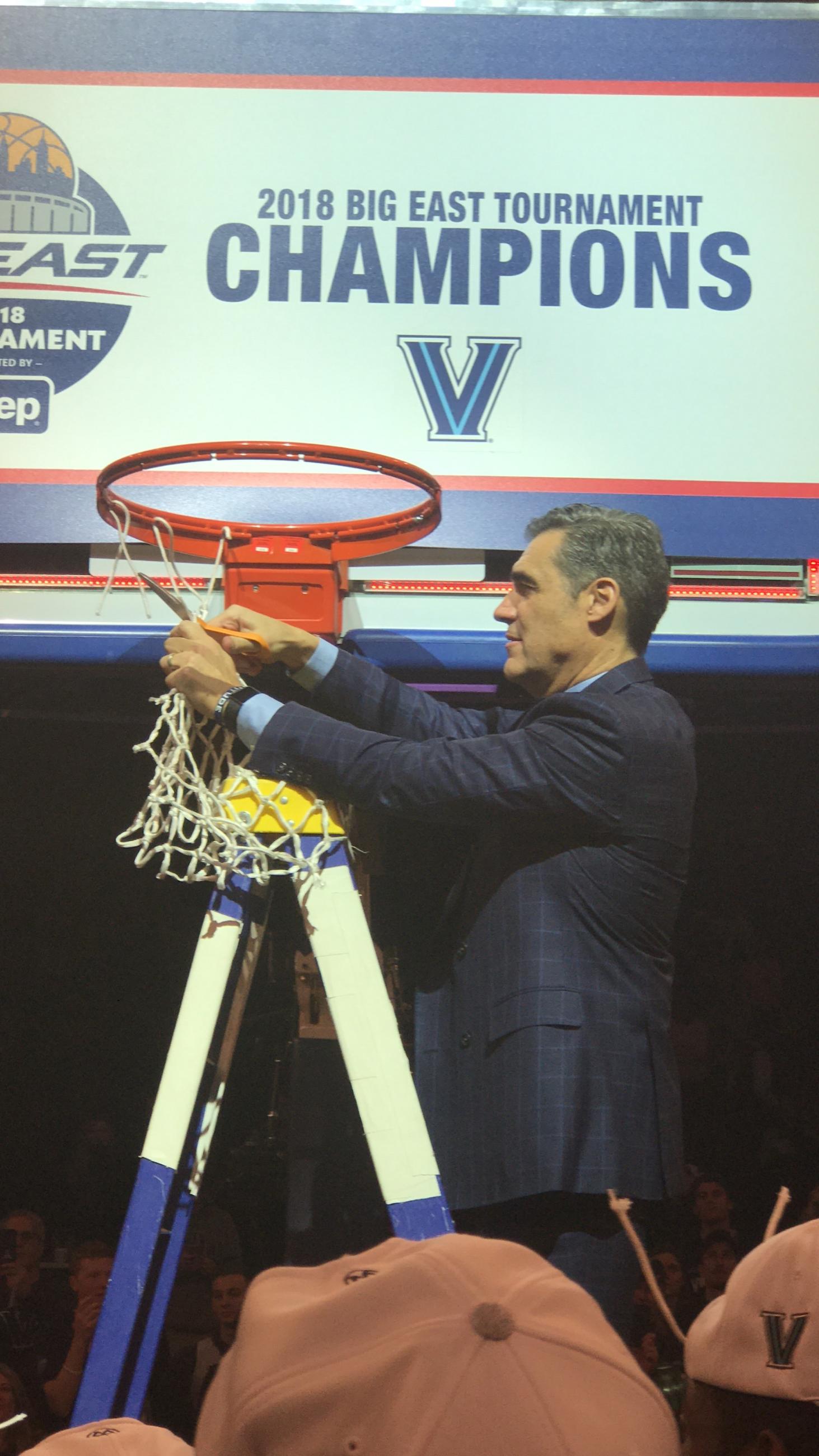 Jay Wright cutting the net after winning the Big East Crown.