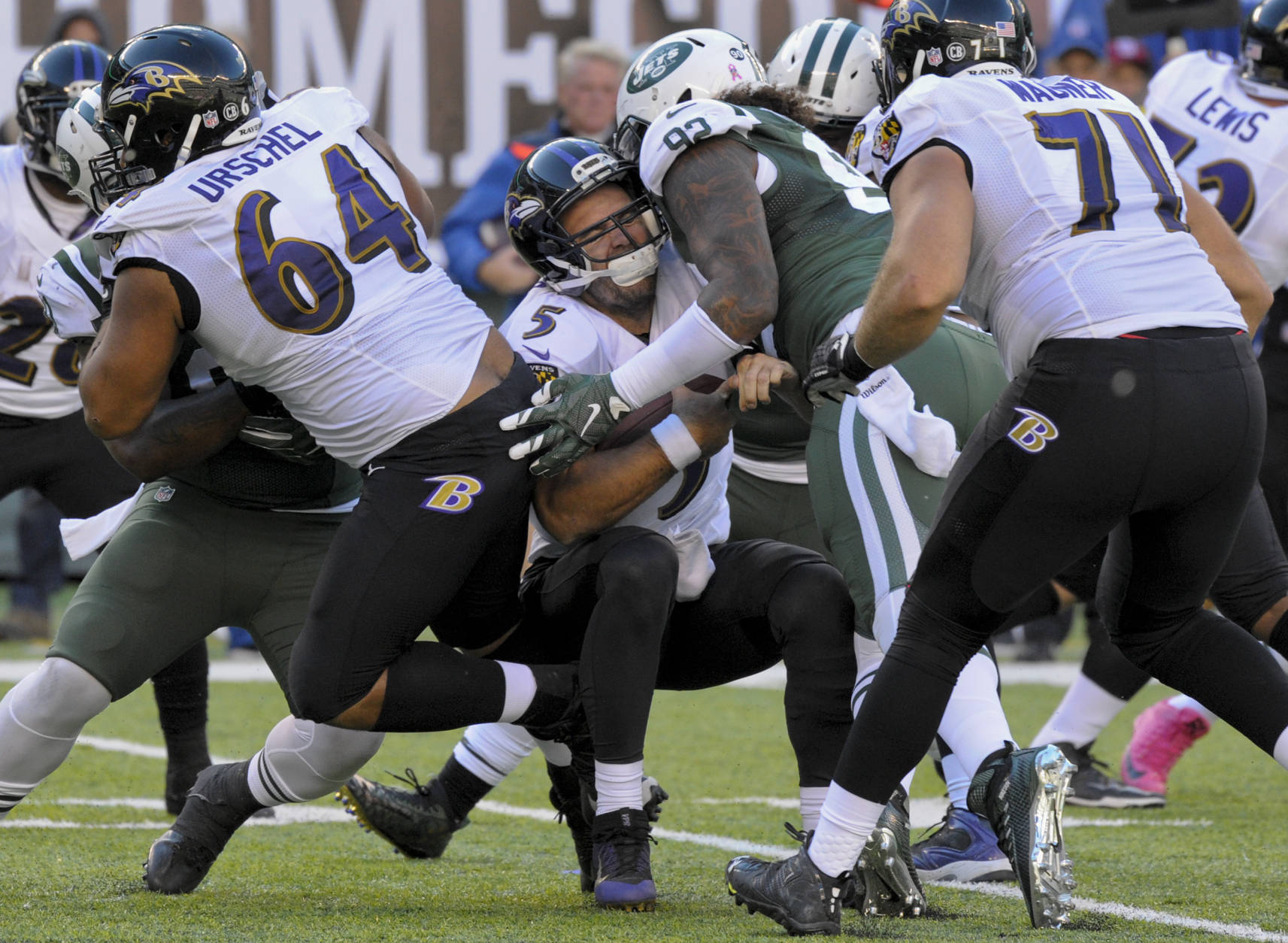 (Photo Credit:AP Photo/Bill Kostroun) The Jets defense put pressure on Flacco all afternoon.